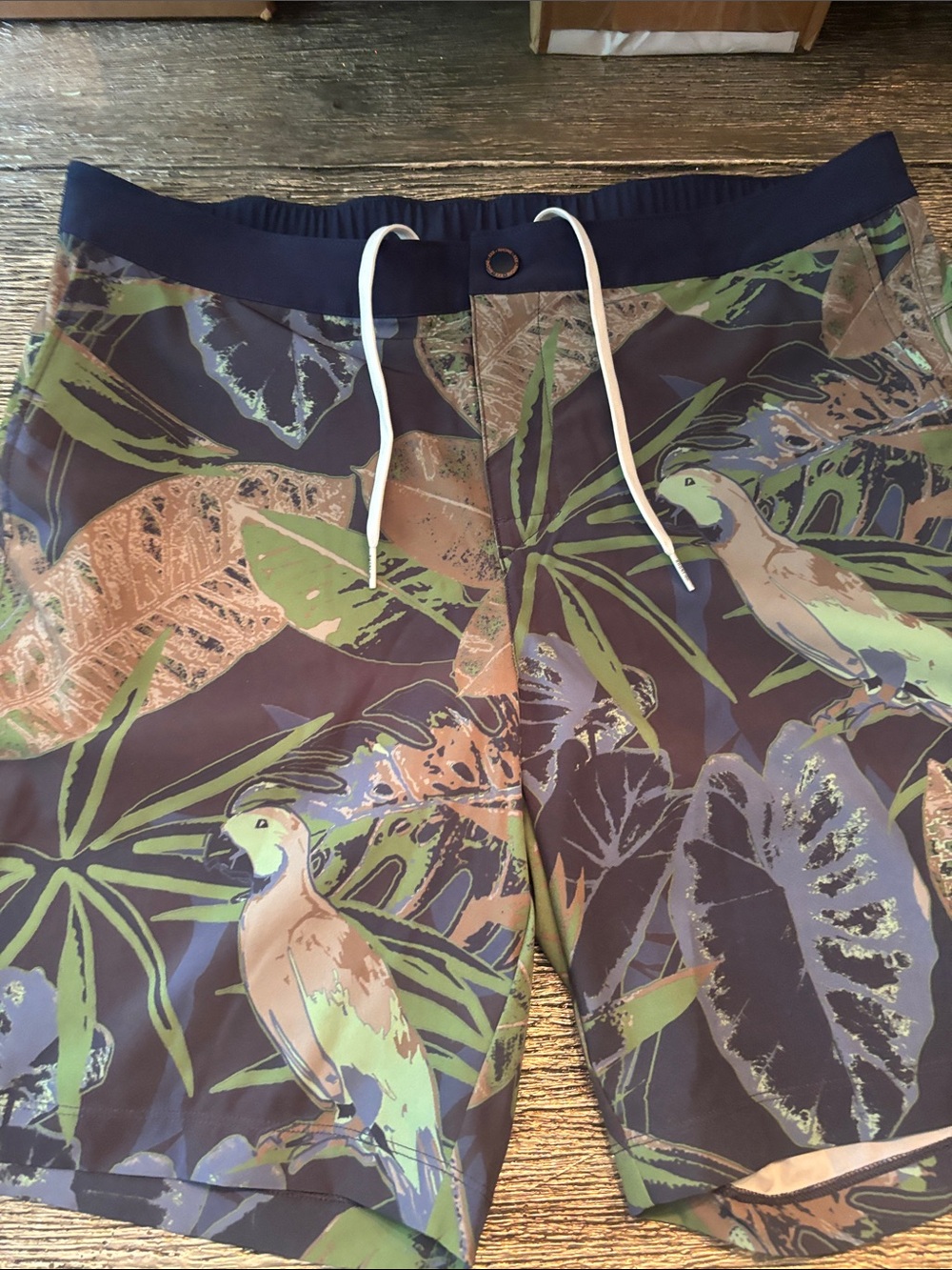 RHONE Tropical Parrot Print Swim Trunks in Navy, Green, Tan